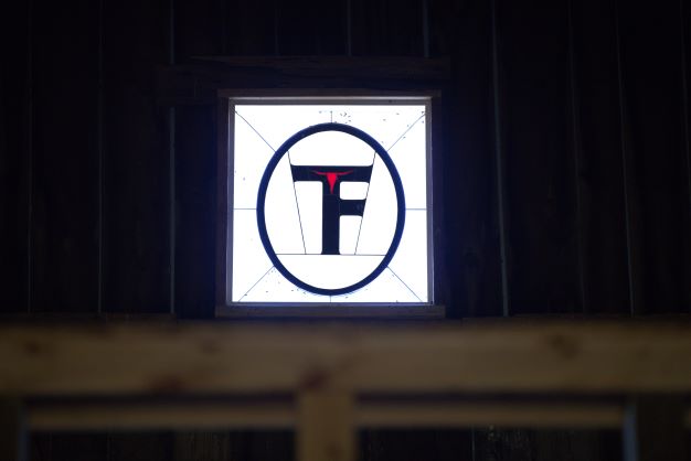 Thornhill farms logo above the wedding deck