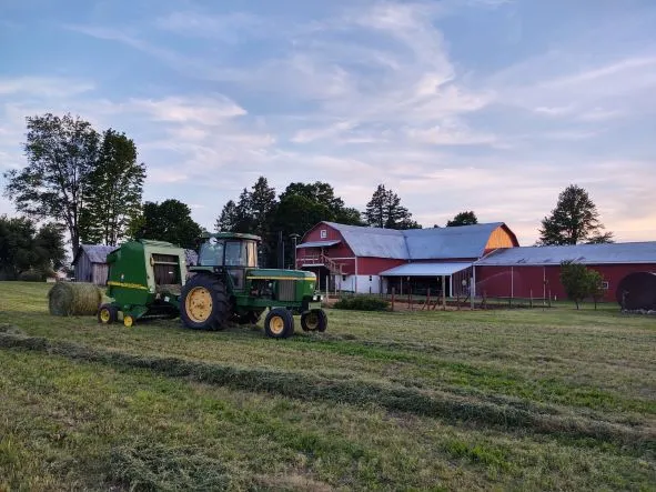 View of thornhill farms hitching post barn with tractor in front